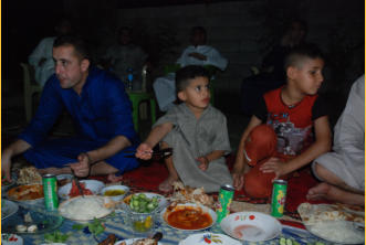 The little boy in the center sits with the adults and learns.  His was father was killed a some time back by ISIS.  Raising him becomes a family affair.  He is a precious child.
