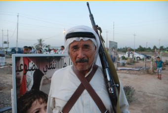 Here, Majad, the father of my good friend Hechmet, is seen on the day of commemorating the beginning of the battle for Dholoyia.  He is 70-years old. He fought on the front lines with the young men.