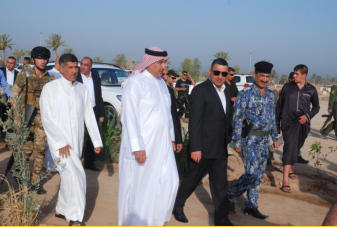The Governor of Salah ad-Din province, Iraq.  He is the one with the sunglasses on.  He is 37-year-old Dr. Raed Ibrahim al-Jubouri.  He is the former director of health in this province.  