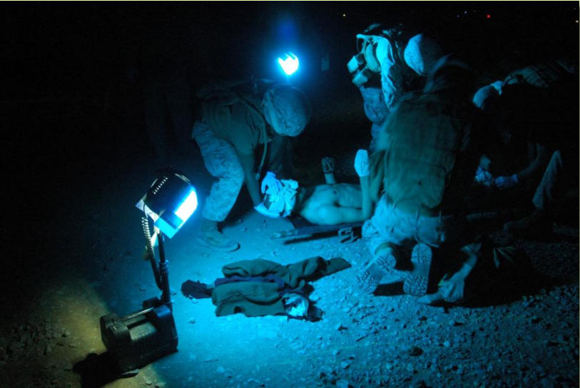 Night photo of wounded being received and treated by STP medical personnel at FOB Edinburgh, March 2, 2012 