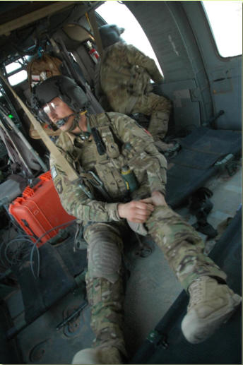 Medic Eric Papp waiting for next patients enroute to next LZ, March 2, 2012