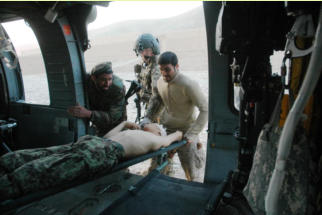 Afghan National Army soldier being loaded onto medevac, March 2, 2012