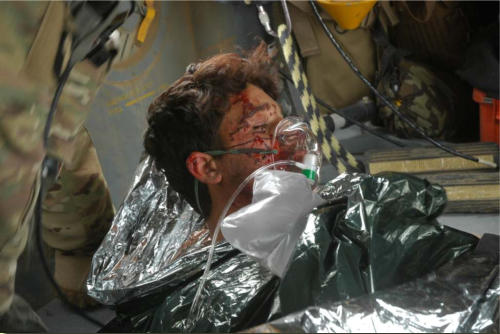 The injured ANA soldier in the helicopter