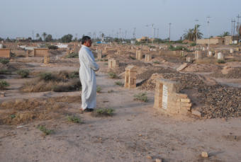 General Abdullah visiting the grave of his brother who had been killed undr orders from American soldiers in June of 2003.  He was killed on false inforation which the brass said there must be some mistake.  He had been accused falsely and the folks occup