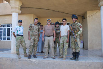 At the police station with my hosts youngest brother, (far Right, Nektal, age 23) and friends.