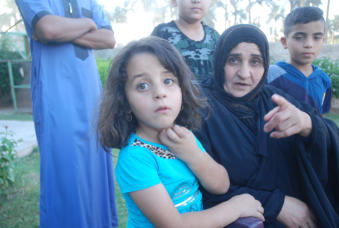 This woman lost two sons.  One son was killed recently and she received only his head.  She now cares for the children left behind.