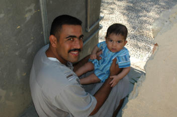 My host's brother, Omar and his son Roslan, age 6-months.