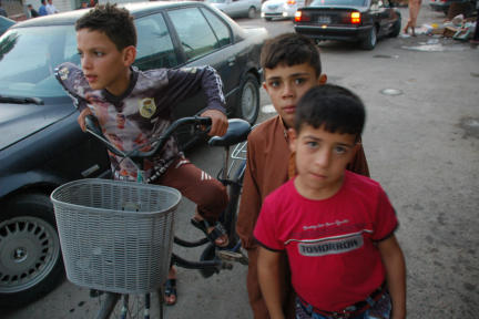 Retrieved photo.  Kids on street at rush hour.