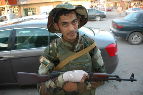 Retrieved photo.  One of the guys who protects the streets in town.  I like this photo a lot.  It reminds me of some in El Salvador.