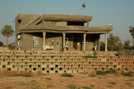 One of the brother's family home.  Iraqi national flag flies over the dwelling.